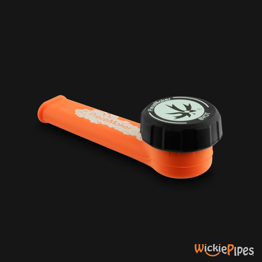 PieceMaker - Karma Octane Orange 3.5-Inch Silicone Hand Pipe with front cap on.